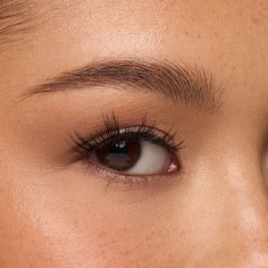 Purrr a flared, medium-length lash with a clustered design and wispy fibers for a lash cluster-inspired look shown on an eye.