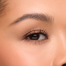 Boudoir Lite a round false lash with medium volume and feathery fibers focused at the center shown on an eye.