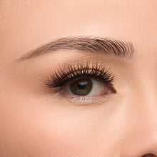 Iconic Luxe false lash with long 4D fluffy layers creating bold volume and dramatically criss-crossed fibers for a textured effect shown on an eye.