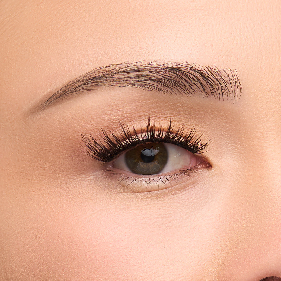 Luna Luxe a round false lash with bold volume concentrated at the base, transitioning to wispy tips shown on an eye.