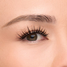 Noir Fairy a long, flared lash with bold volume and spiky fibers creating a wet lash look shown on an eye.