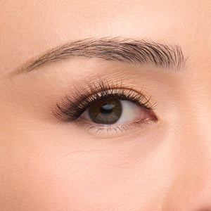 Show Off a false lash with delicately tapered inner corners transition into flared outer corners designed with extra-long wispy fibers and bold volume shown on an eye.