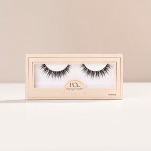 Divine Lite flared false lashes with medium volume and spiky clusters for a wet mascara effect.