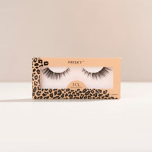 Frisky false lash with natural inner corners transition into flared wispy outer corners.