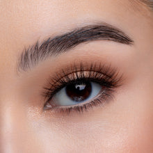 A front view of a woman's eye wearing Americano False Eye Lashes.