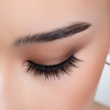 A top view of a woman's eye wearing Emiko false eyelashes.