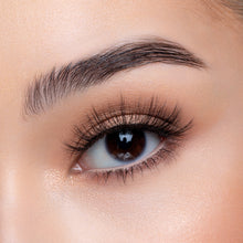 A front view of a woman's eye wearing Emiko false eyelashes.