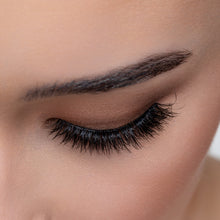 A top view of a woman's eye wearing Femme Fatale false eyelashes.