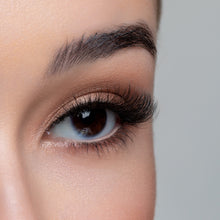 A side view of a woman's eye wearing Femme Fatale false eyelashes.