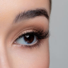 A side view of a woman's eye wearing Kitty Cat false eyelashes. 