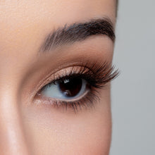 A side view of a woman's eye wearing Latte false eyelashes.