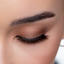 A top view of a woman's eye wearing Macchiato false eyelashes.