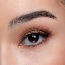 A front view of a woman's eye wearing Macchiato false eyelashes.