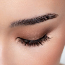 A top view of a woman's eye wearing Mika false eyelashes.