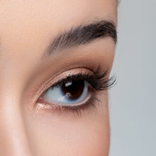 A side view of a woman's eye wearing Mika false eyelashes.