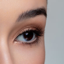 A side view of a woman's eye wearing Mocha false eyelashes.