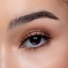 A front view of a woman's eye wearing Mocha false eyelashes.