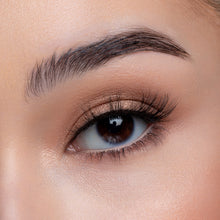 A front view of a woman's eye wearing Purrr™.