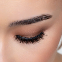 A top view of a woman's eye wearing Yumi false eyelashes.