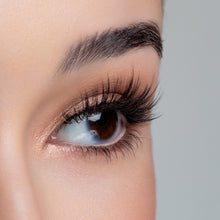 A side view of a woman's eye wearing Yumi false eyelashes.