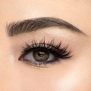 A front view of a woman's eye wearing Iconic fasle eyelashes.