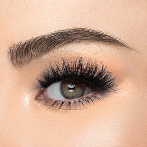 A front view of a woman's eye wearing Iconic Luxe.