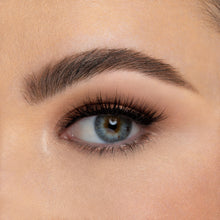 A front view of a woman's eye wearing Audrey Mini false eyelashes.