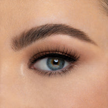 A front view of a woman's eye wearing Love & Light false eyelashes.