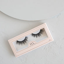 Ethereal Lite false eyelashes in packaging on a textured background.