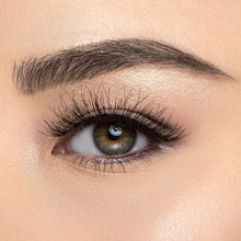 A front view of a woman's eye wearing Temptress Wispy®.